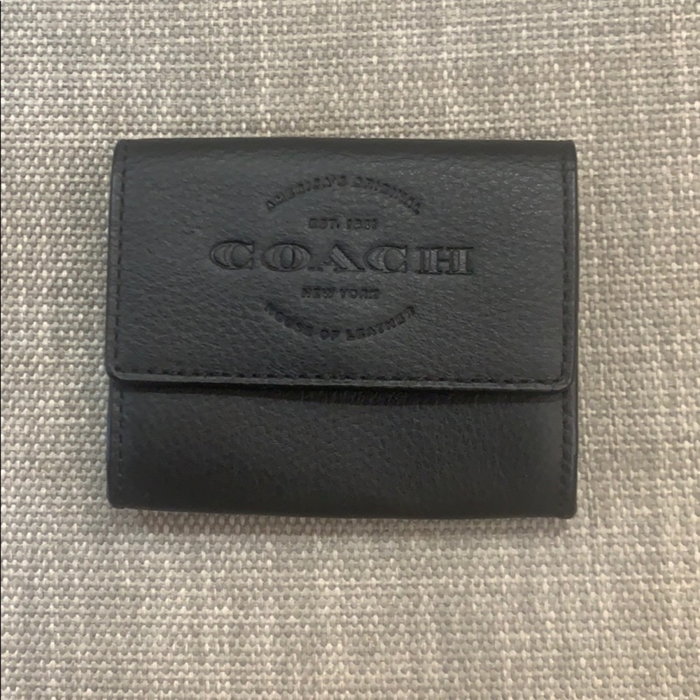 NWT Coach black leather wallet.